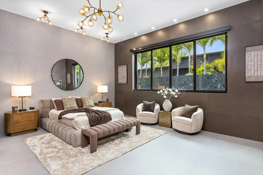 $10 Million Stunning Contemporary Estate Redefining Luxury Living in Fort Lauderdale 10 Modern kitchen at 2301 NE 37th Drive highlighting walnut cabinetry and refined stone surfaces