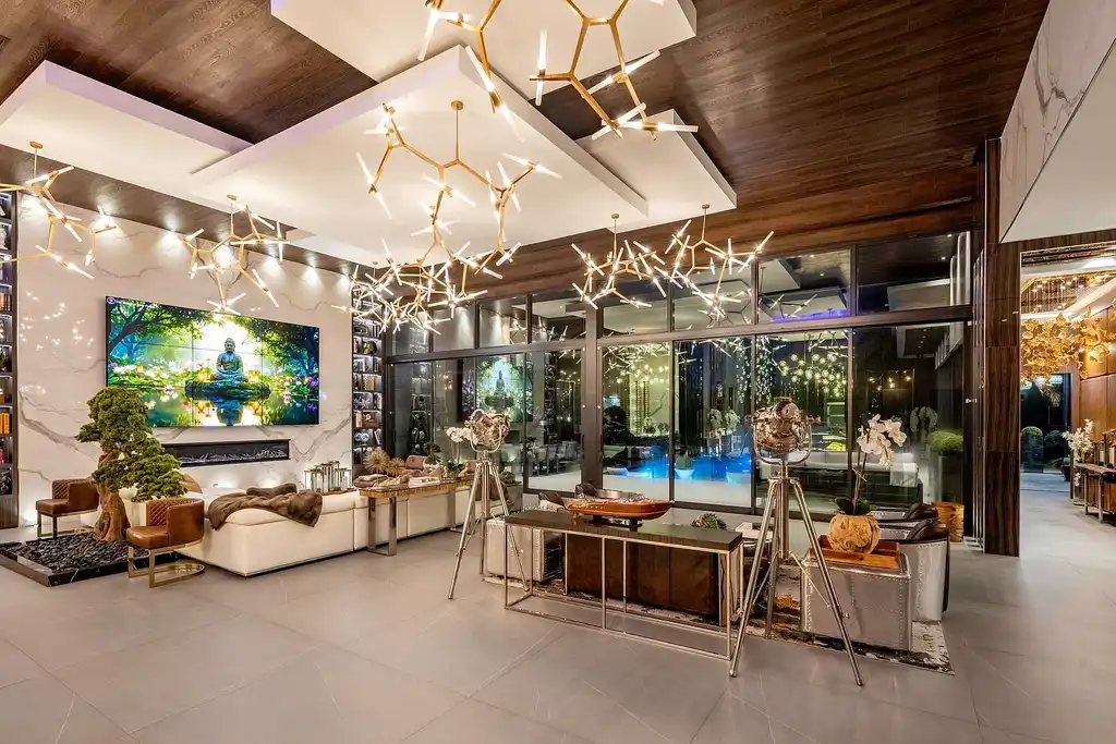 $10 Million Stunning Contemporary Estate Redefining Luxury Living in Fort Lauderdale 6 Modern kitchen at 2301 NE 37th Drive highlighting walnut cabinetry and refined stone surfaces