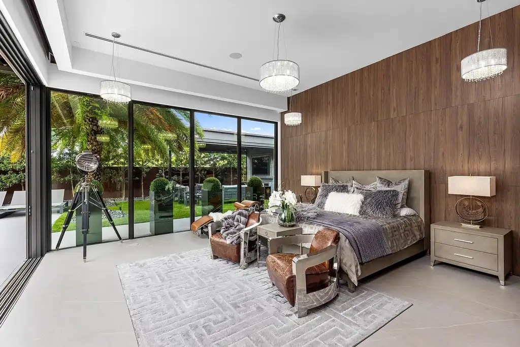 $10 Million Stunning Contemporary Estate Redefining Luxury Living in Fort Lauderdale 14 Modern kitchen at 2301 NE 37th Drive highlighting walnut cabinetry and refined stone surfaces