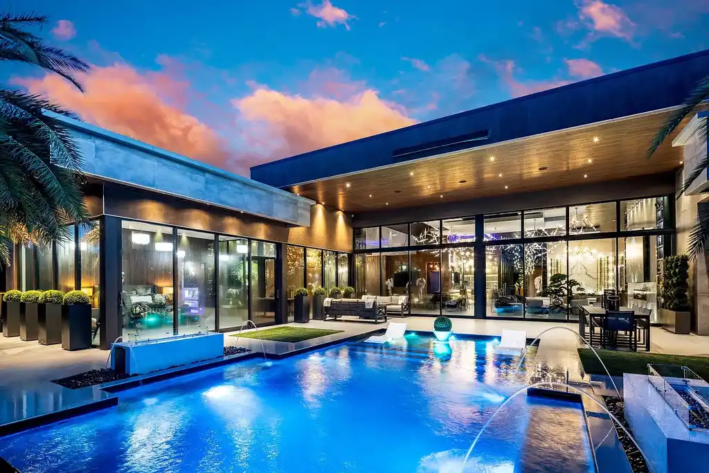 $10 Million Stunning Contemporary Estate Redefining Luxury Living in Fort Lauderdale 18 Modern kitchen at 2301 NE 37th Drive highlighting walnut cabinetry and refined stone surfaces