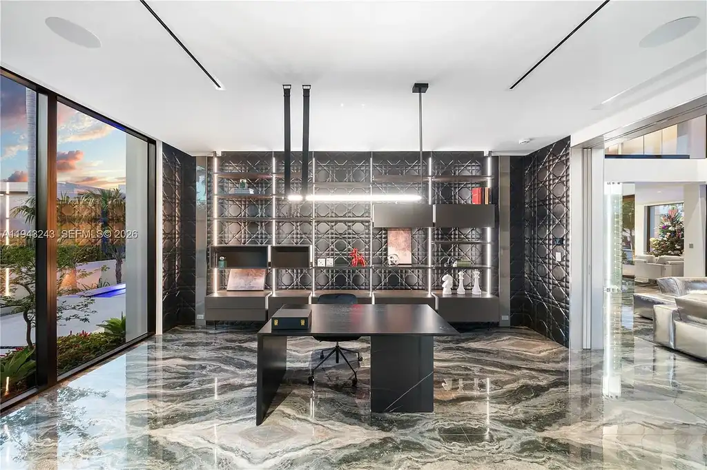 $14.4 Million Extraordinary Waterfront Estate Sets a New Standard for Luxury Living in Fort Lauderdale 16 Dining and lounge space at 340 San Marco Dr highlighting book-matched porcelain floors and refined modern interiors.