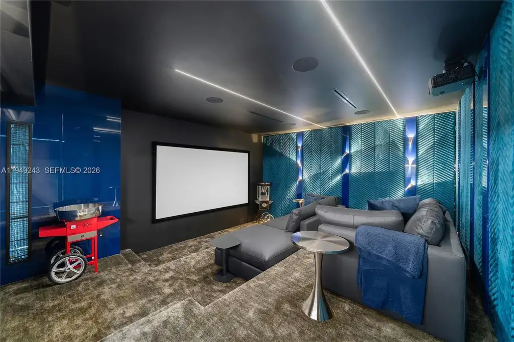 $14.4 Million Extraordinary Waterfront Estate Sets a New Standard for Luxury Living in Fort Lauderdale 15 Dining and lounge space at 340 San Marco Dr highlighting book-matched porcelain floors and refined modern interiors.