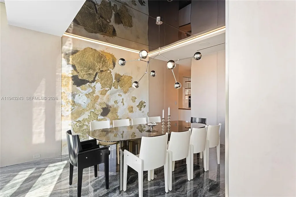 $14.4 Million Extraordinary Waterfront Estate Sets a New Standard for Luxury Living in Fort Lauderdale 10 Dining and lounge space at 340 San Marco Dr highlighting book-matched porcelain floors and refined modern interiors.