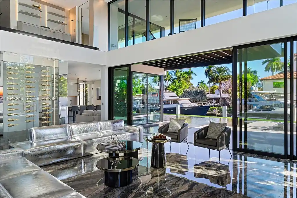 $14.4 Million Extraordinary Waterfront Estate Sets a New Standard for Luxury Living in Fort Lauderdale 7 Dining and lounge space at 340 San Marco Dr highlighting book-matched porcelain floors and refined modern interiors.