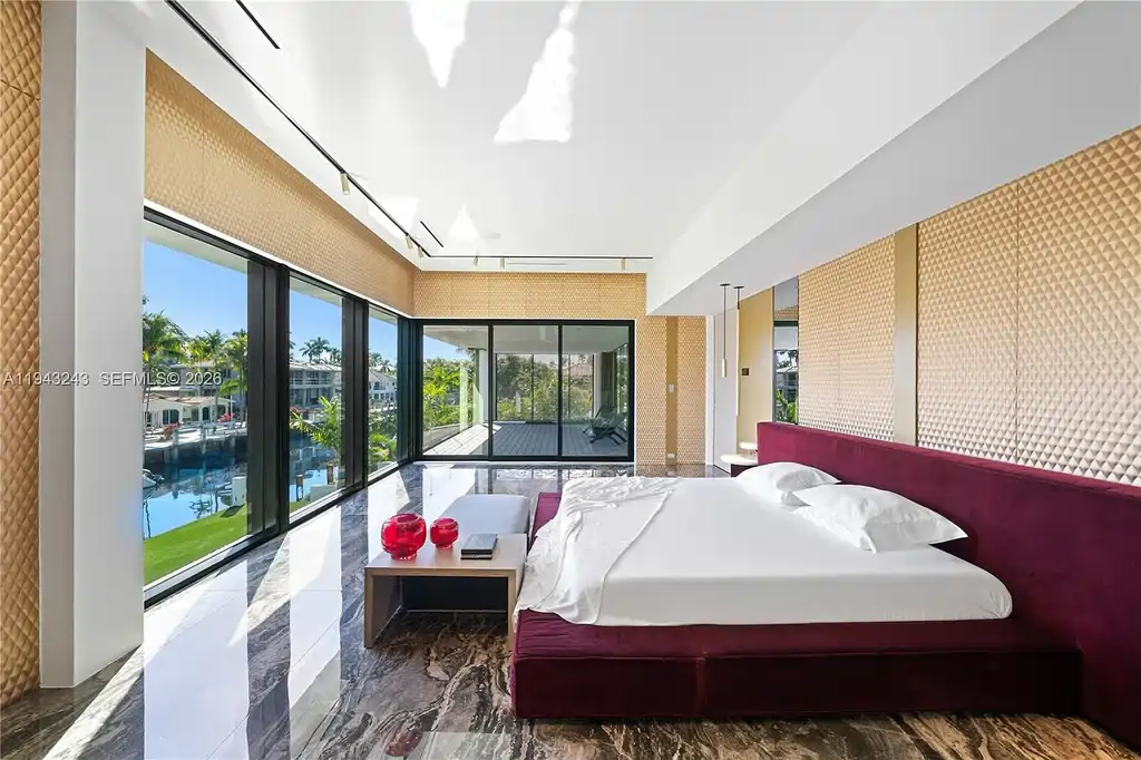 $14.4 Million Extraordinary Waterfront Estate Sets a New Standard for Luxury Living in Fort Lauderdale 11 Dining and lounge space at 340 San Marco Dr highlighting book-matched porcelain floors and refined modern interiors.