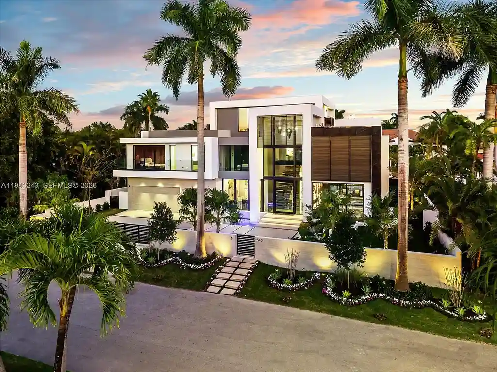 $14.4 Million Extraordinary Waterfront Estate Sets a New Standard for Luxury Living in Fort Lauderdale 6 Dining and lounge space at 340 San Marco Dr highlighting book-matched porcelain floors and refined modern interiors.