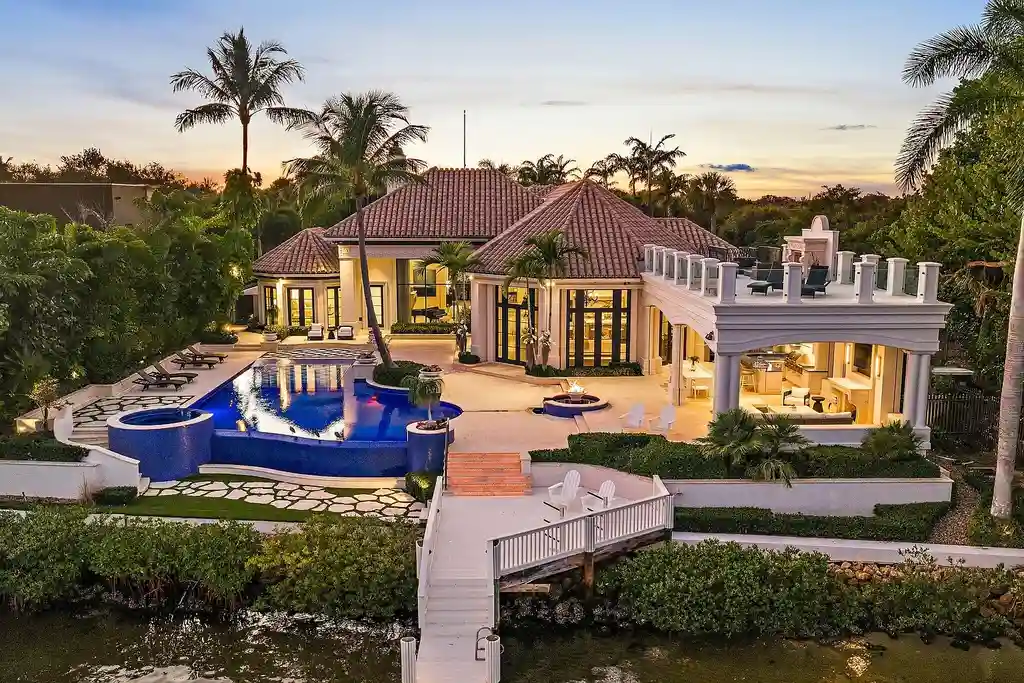 $32 Million Waterfront Icon Redefining Luxury Living in Jupiter Real Estate 5 Waterfront exterior of 372 Regatta Drive in Jupiter, showcasing Intracoastal frontage and luxury estate setting