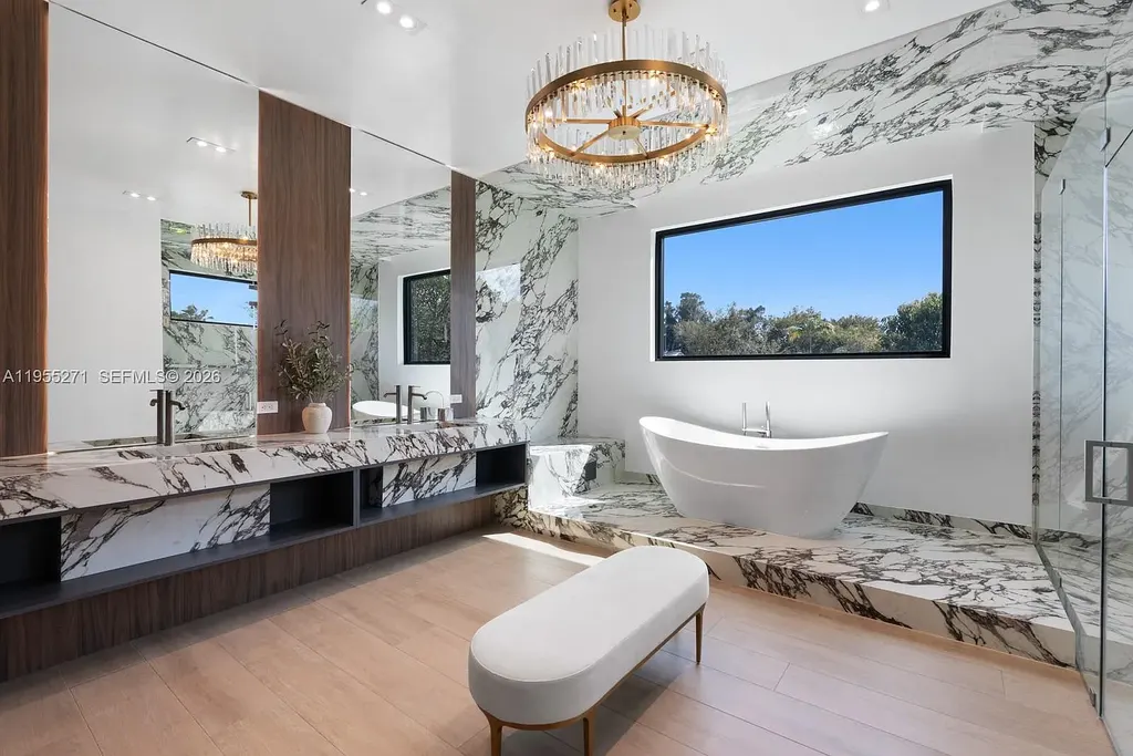 $16.7 Million Newly Built Estate Sets a New Benchmark for Luxury Living in Pinecrest 14 Front exterior of a newly built luxury home at 5900 SW 129th Ter in Pinecrest, Florida, showcasing modern architecture and landscaped grounds
