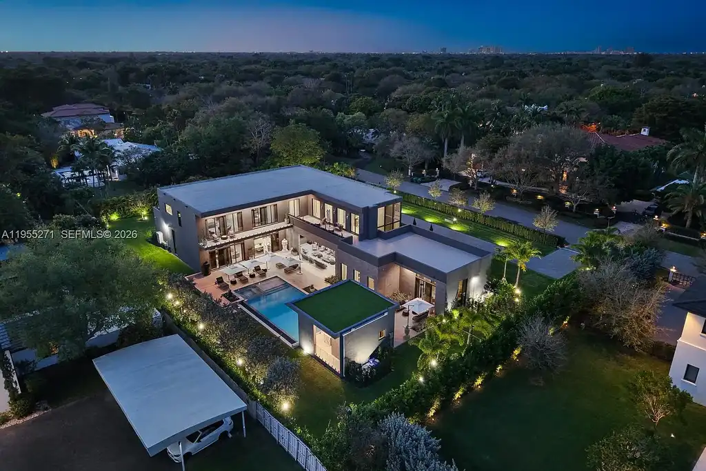 $16.7 Million Newly Built Estate Sets a New Benchmark for Luxury Living in Pinecrest 17 Front exterior of a newly built luxury home at 5900 SW 129th Ter in Pinecrest, Florida, showcasing modern architecture and landscaped grounds