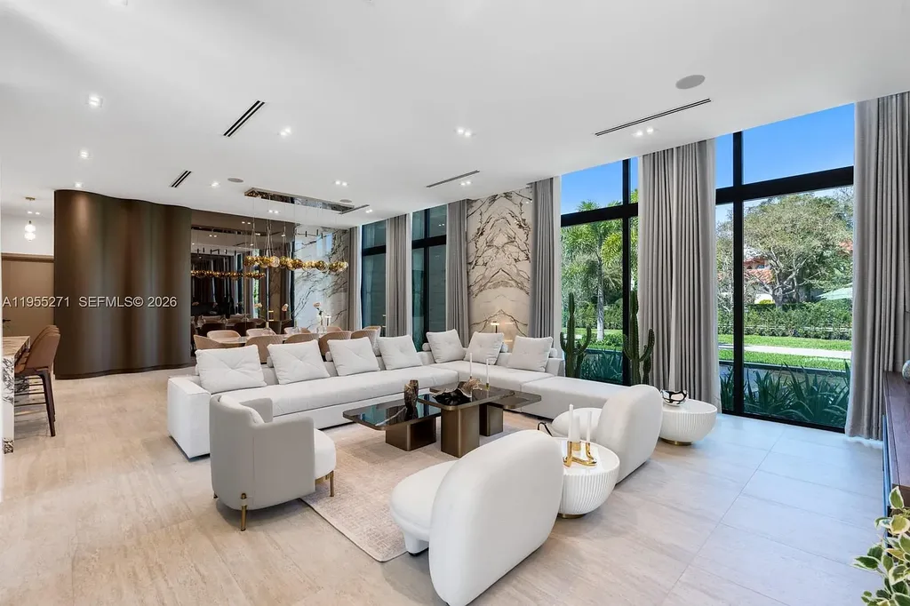 $16.7 Million Newly Built Estate Sets a New Benchmark for Luxury Living in Pinecrest 8 Front exterior of a newly built luxury home at 5900 SW 129th Ter in Pinecrest, Florida, showcasing modern architecture and landscaped grounds
