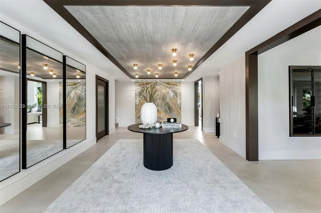 $15.8 Million Trophy Waterfront Estate Redefining Luxury Living in Coral Gables 6 Waterfront exterior of 6970 Sunrise Dr showcasing a contemporary estate with canal frontage and direct access to Biscayne Bay in Coral Gables