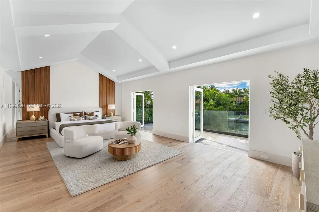 $15.8 Million Trophy Waterfront Estate Redefining Luxury Living in Coral Gables 12 Waterfront exterior of 6970 Sunrise Dr showcasing a contemporary estate with canal frontage and direct access to Biscayne Bay in Coral Gables