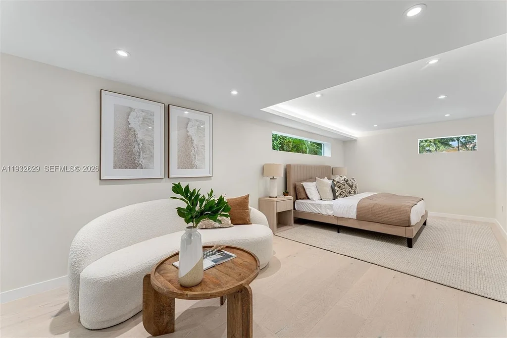 $15.8 Million Trophy Waterfront Estate Redefining Luxury Living in Coral Gables 14 Waterfront exterior of 6970 Sunrise Dr showcasing a contemporary estate with canal frontage and direct access to Biscayne Bay in Coral Gables