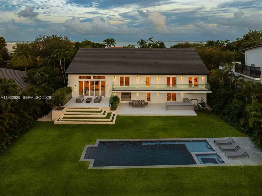 $15.8 Million Trophy Waterfront Estate Redefining Luxury Living in Coral Gables 16 Waterfront exterior of 6970 Sunrise Dr showcasing a contemporary estate with canal frontage and direct access to Biscayne Bay in Coral Gables