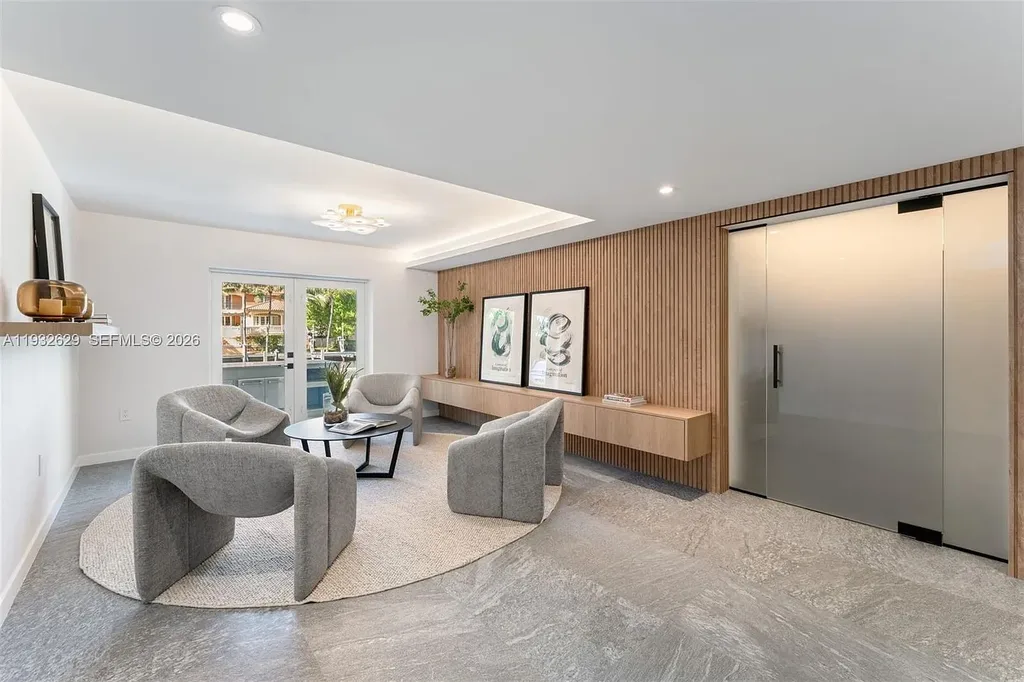 $15.8 Million Trophy Waterfront Estate Redefining Luxury Living in Coral Gables 15 Waterfront exterior of 6970 Sunrise Dr showcasing a contemporary estate with canal frontage and direct access to Biscayne Bay in Coral Gables