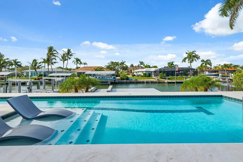 $6.7 Million Brand New Waterfront Masterpiece Offering Direct Gulf Access and Sunset Views on Marco Island 6 920 Iris Ct waterfront home on Marco Island showcasing contemporary architecture and direct Gulf access