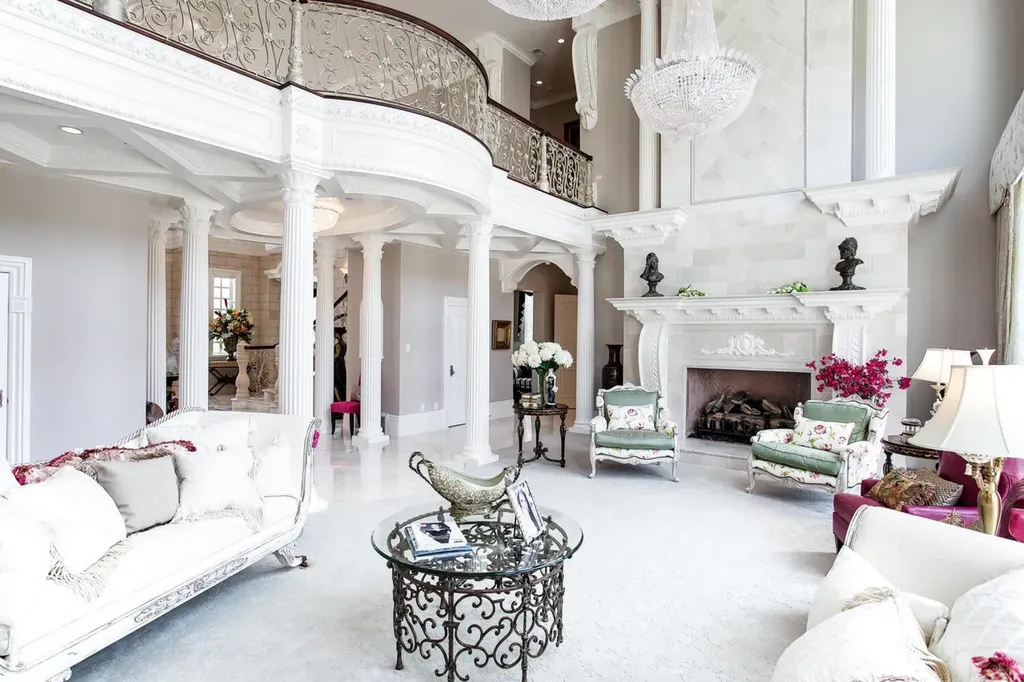 Hobble Creek Ranch: A 3,387-Acre Legacy Estate in Springville, Utah, Asking $38 Million 5 Formal living room at Hobble Creek Ranch showcasing double-height ceilings, classical columns, an upper-level gallery balcony, ornate fireplace, and crystal chandeliers in Springville, Utah.