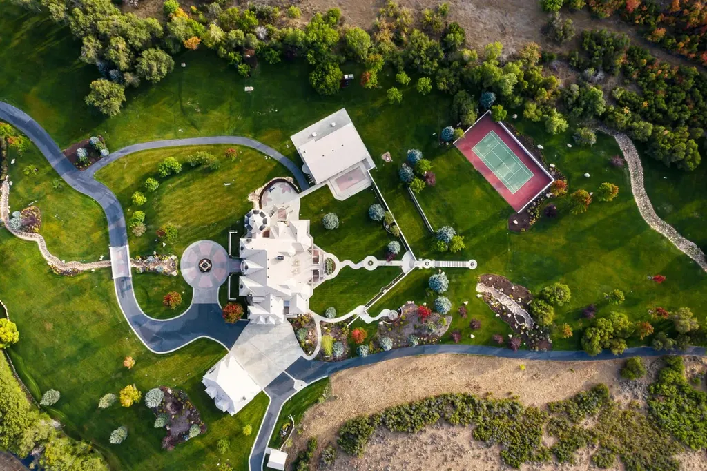 Hobble Creek Ranch: A 3,387-Acre Legacy Estate in Springville, Utah, Asking $38 Million 2 Top-down aerial view of Hobble Creek Ranch showing the main residence, guest buildings, landscaped grounds, and a private tennis court in Springville, Utah.
