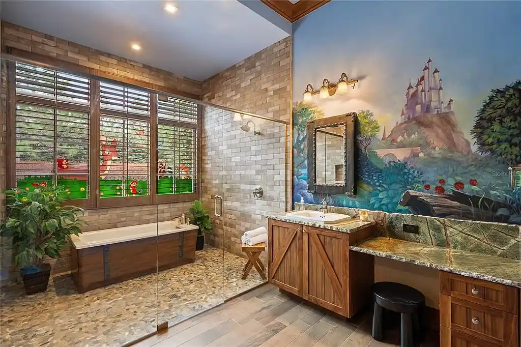 $10.5Million Spectacular Reimagined Luxury Estate in Golden Oak, Orlando 15 Front exterior view of 10012 Hyperion Ln luxury home in Orlando with arched entry and manicured landscaping