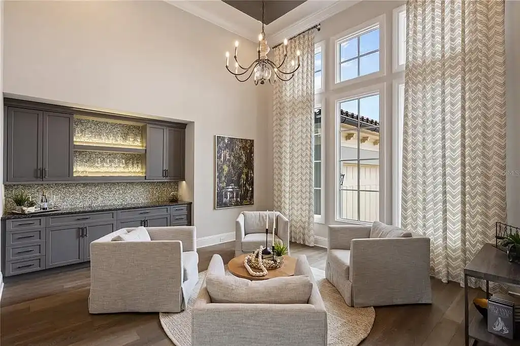 $10.5Million Spectacular Reimagined Luxury Estate in Golden Oak, Orlando 11 Front exterior view of 10012 Hyperion Ln luxury home in Orlando with arched entry and manicured landscaping