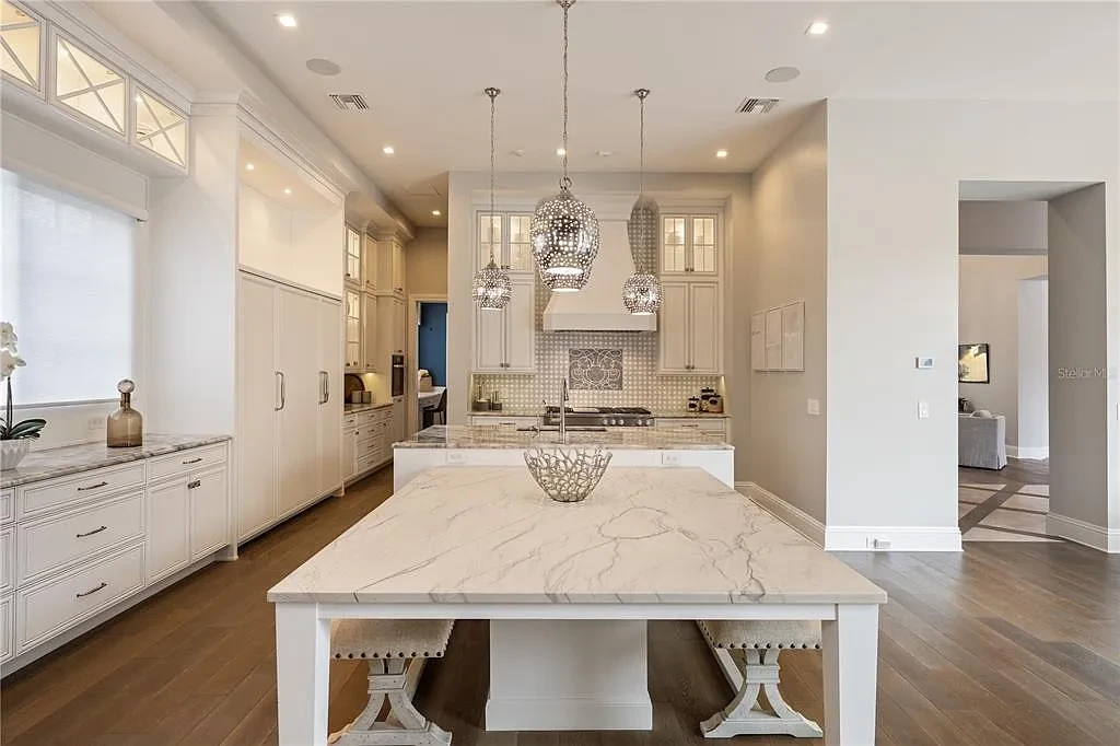 $10.5Million Spectacular Reimagined Luxury Estate in Golden Oak, Orlando 8 Front exterior view of 10012 Hyperion Ln luxury home in Orlando with arched entry and manicured landscaping