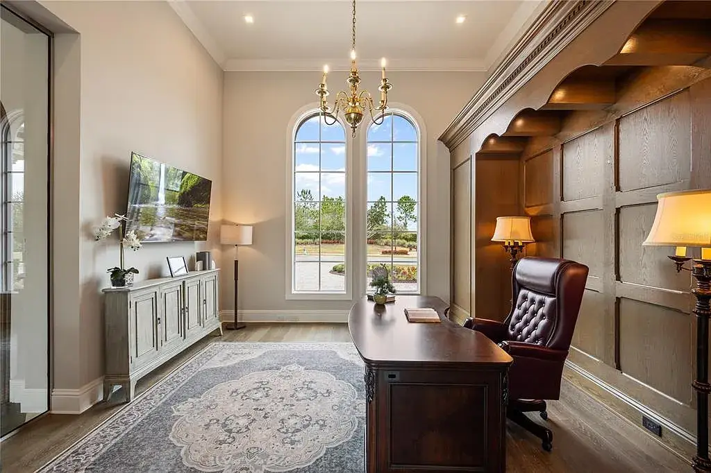 $10.5Million Spectacular Reimagined Luxury Estate in Golden Oak, Orlando 16 Front exterior view of 10012 Hyperion Ln luxury home in Orlando with arched entry and manicured landscaping