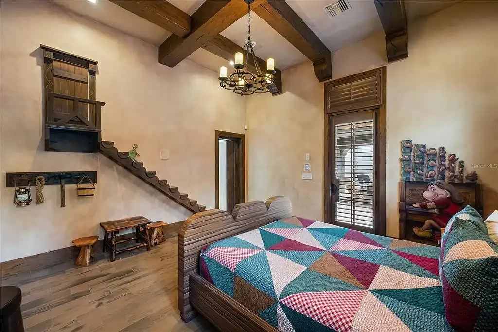 $10.5Million Spectacular Reimagined Luxury Estate in Golden Oak, Orlando 14 Front exterior view of 10012 Hyperion Ln luxury home in Orlando with arched entry and manicured landscaping