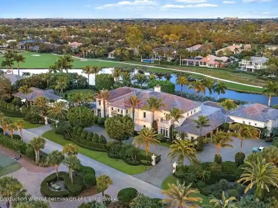$45 Million Spectacular Lakefront Golf Estate in Old Marsh Club Showcases Elite West Palm Beach Luxury Living 1 12980 Sabal Chase Showcases a 45 Million Trophy Estate Elevating West Palm Beach Real Estate Prestige 1
