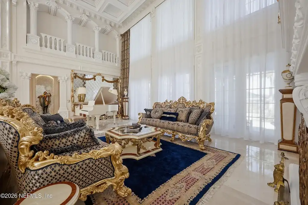 Stunning $7 Million Private Waterfront Estate in Jacksonville Redefines Luxury Living with Nearly Five Acres 6 Front exterior view of luxury waterfront estate in Jacksonville featuring grand neoclassical architecture, private acreage, and resort-style pool at 1370 MOSS CREEK Drive.