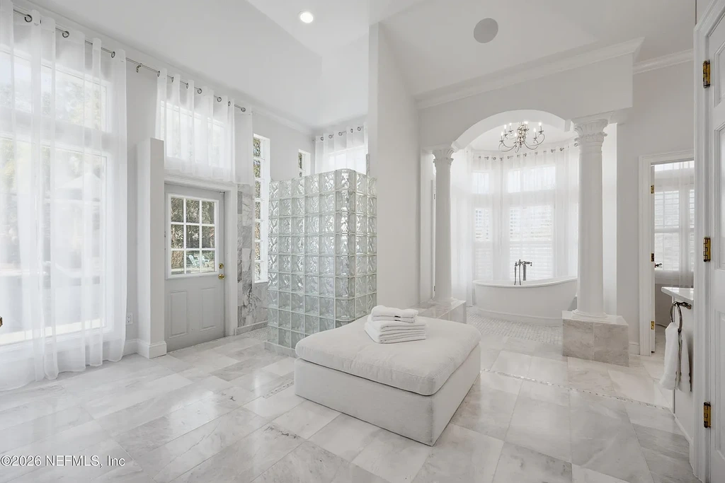 Stunning $7 Million Private Waterfront Estate in Jacksonville Redefines Luxury Living with Nearly Five Acres 13 Front exterior view of luxury waterfront estate in Jacksonville featuring grand neoclassical architecture, private acreage, and resort-style pool at 1370 MOSS CREEK Drive.