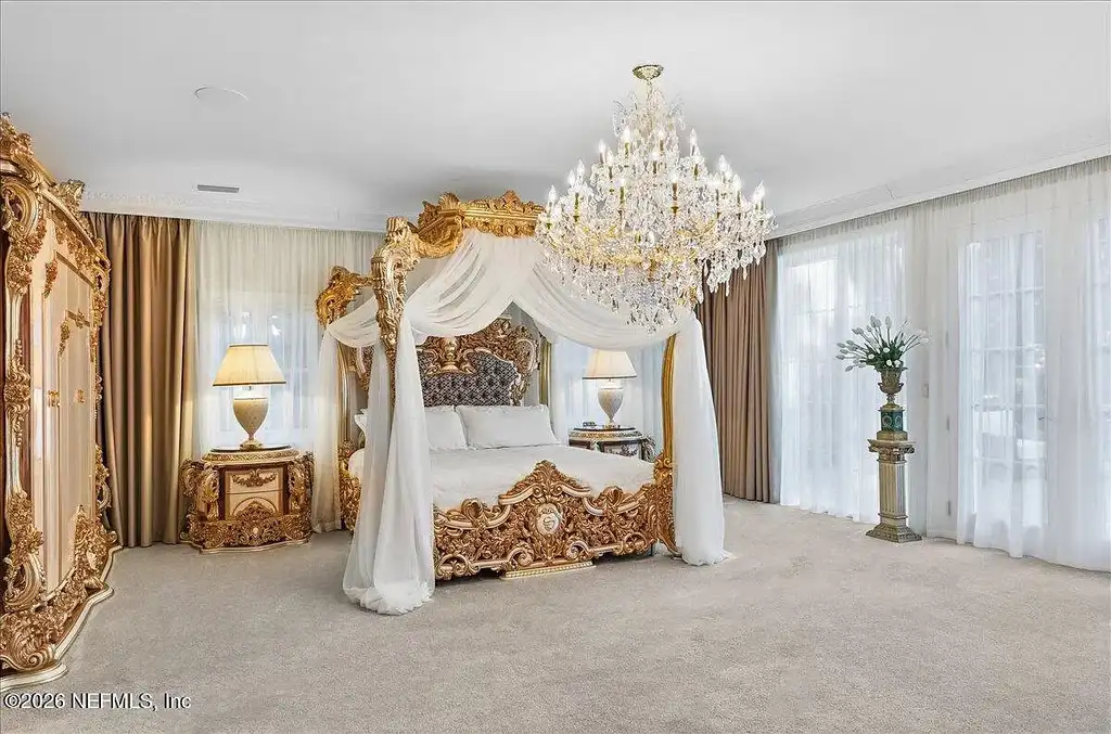 Stunning $7 Million Private Waterfront Estate in Jacksonville Redefines Luxury Living with Nearly Five Acres 10 Front exterior view of luxury waterfront estate in Jacksonville featuring grand neoclassical architecture, private acreage, and resort-style pool at 1370 MOSS CREEK Drive.