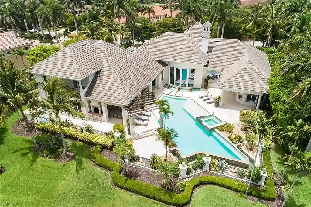 A Fully Reimagined Grey Oaks Estate in Naples Lists for $10 Million With Water and Fairway Views 16 State-of-the-art kitchen with dual islands and Wolf appliances inside 2145 Canna Way in Naples