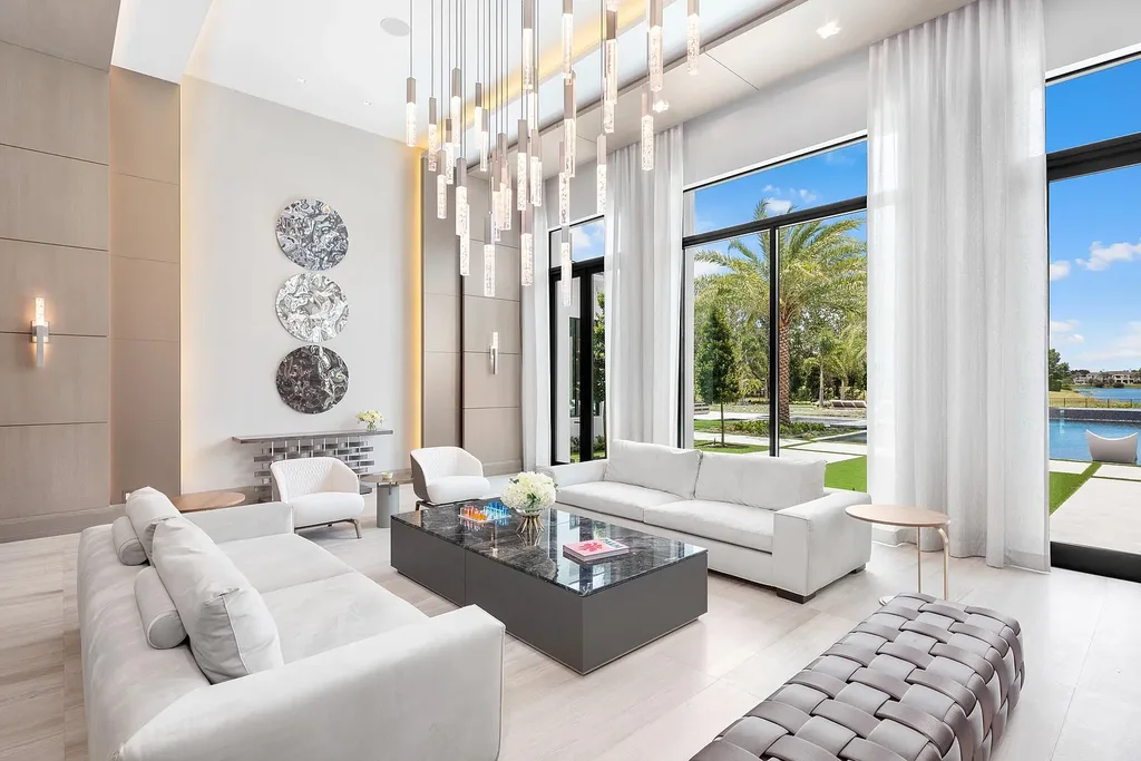 $55 Million Lakefront Estate in Delray Beach’s Stone Creek Ranch Showcases Resort-Style Luxury and Rare Double-Lot Privacy 7 Luxury lakefront estate exterior at 16191 Quiet Vista Circle in Delray Beach featuring expansive landscaping and contemporary architecture