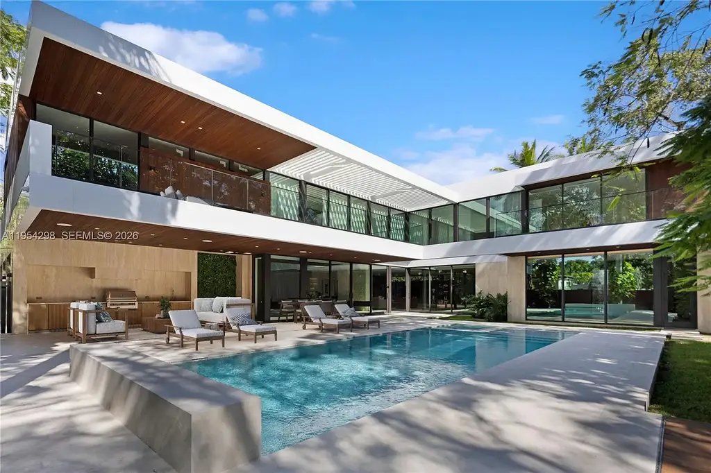 Spectacular $18 Million Ultra-Luxury New Construction Estate in Miami Showcases Iconic Modern Design 5 Modern ultra-luxury estate at 3210 Coacoochee St in Miami featuring contemporary architecture, expansive glass walls, private terraces, resort-style pool and spa, and landscaped tropical outdoor living areas.