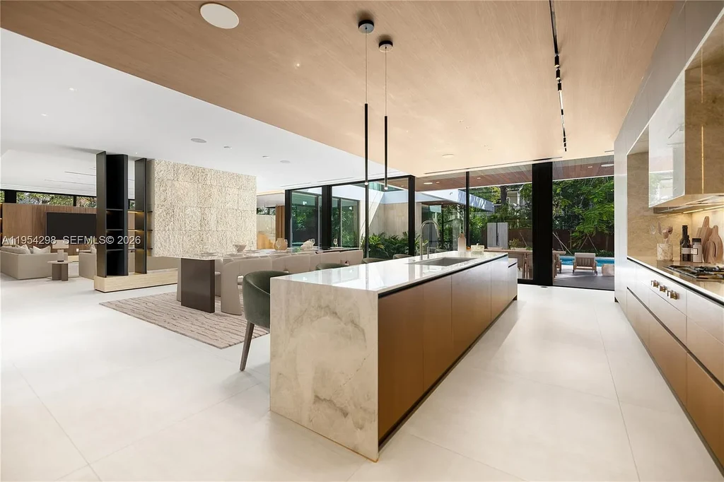Spectacular $18 Million Ultra-Luxury New Construction Estate in Miami Showcases Iconic Modern Design 7 Modern ultra-luxury estate at 3210 Coacoochee St in Miami featuring contemporary architecture, expansive glass walls, private terraces, resort-style pool and spa, and landscaped tropical outdoor living areas.