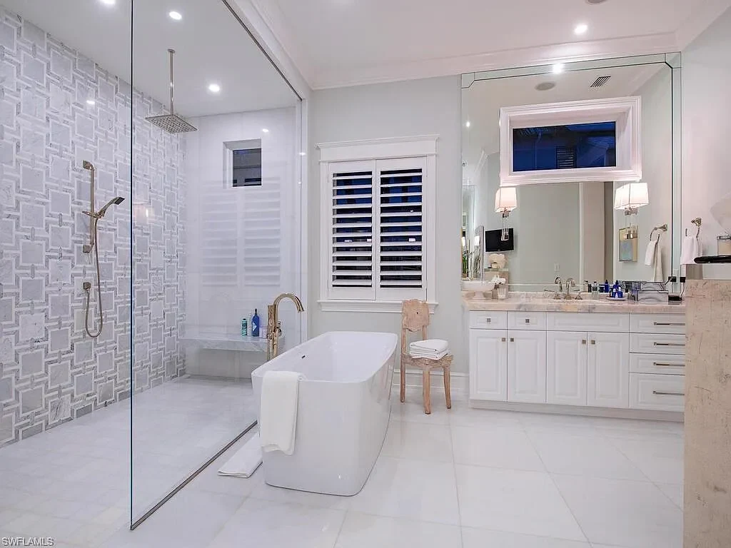 $17.9 Million Turnkey Waterfront Estate Offers Exceptional Living in Port Royal, Naples 12 Front exterior view of 3243 Gin LN, a $17.9 million waterfront estate in Port Royal, Naples