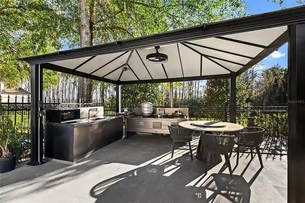 $5.7 Million Newly Remodeled Isleworth Golf Estate Showcases Spectacular Resort-Style Luxury in Windermere 16 Aerial view of 5186 Vardon Dr luxury estate showcasing golf course frontage and resort-style outdoor amenities