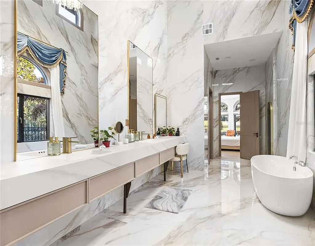 $5.7 Million Newly Remodeled Isleworth Golf Estate Showcases Spectacular Resort-Style Luxury in Windermere 13 Aerial view of 5186 Vardon Dr luxury estate showcasing golf course frontage and resort-style outdoor amenities