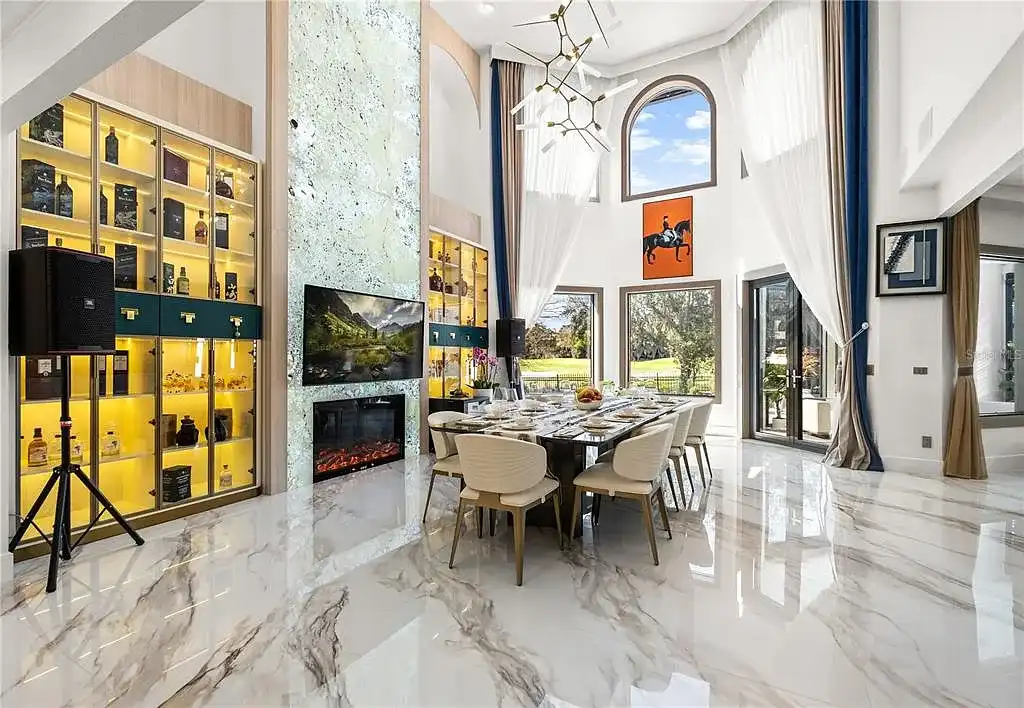 $5.7 Million Newly Remodeled Isleworth Golf Estate Showcases Spectacular Resort-Style Luxury in Windermere 10 Aerial view of 5186 Vardon Dr luxury estate showcasing golf course frontage and resort-style outdoor amenities