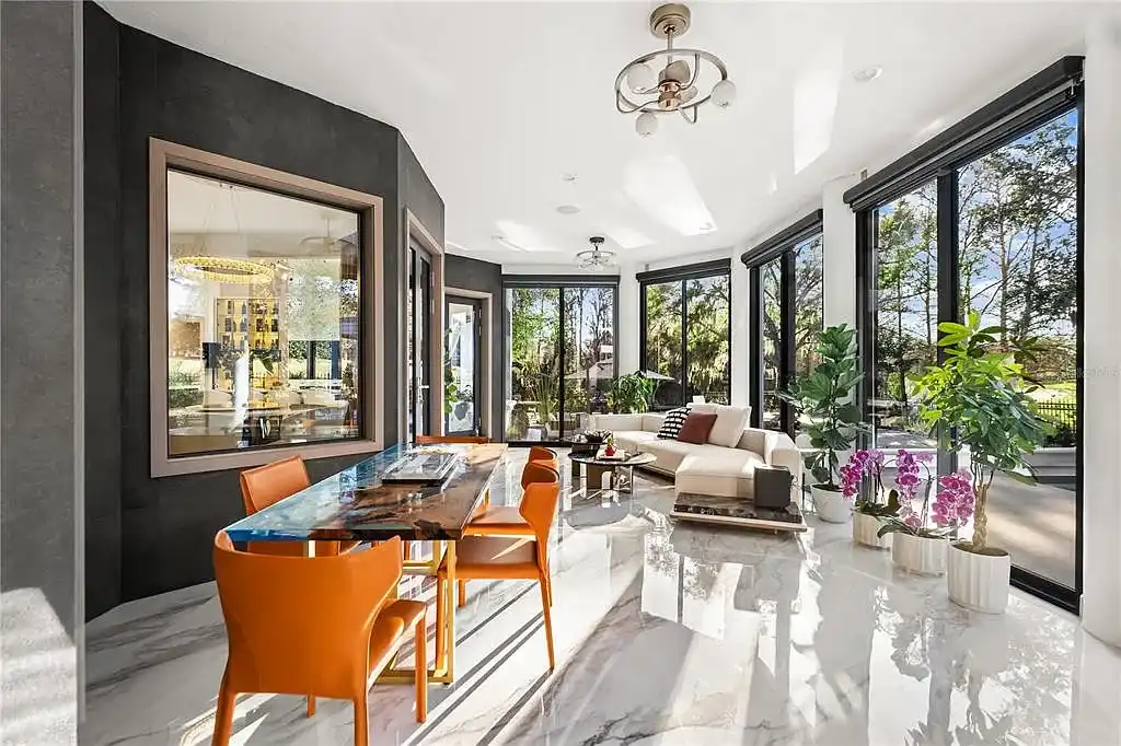 $5.7 Million Newly Remodeled Isleworth Golf Estate Showcases Spectacular Resort-Style Luxury in Windermere 11 Aerial view of 5186 Vardon Dr luxury estate showcasing golf course frontage and resort-style outdoor amenities