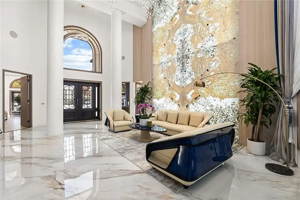 $5.7 Million Newly Remodeled Isleworth Golf Estate Showcases Spectacular Resort-Style Luxury in Windermere 6 Aerial view of 5186 Vardon Dr luxury estate showcasing golf course frontage and resort-style outdoor amenities