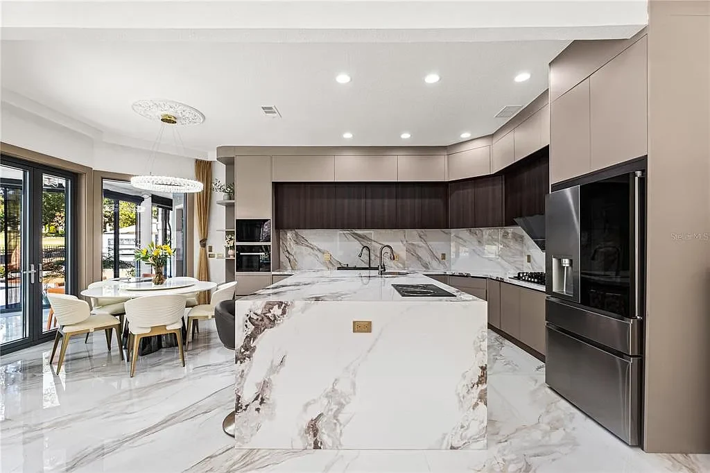 $5.7 Million Newly Remodeled Isleworth Golf Estate Showcases Spectacular Resort-Style Luxury in Windermere 8 Aerial view of 5186 Vardon Dr luxury estate showcasing golf course frontage and resort-style outdoor amenities