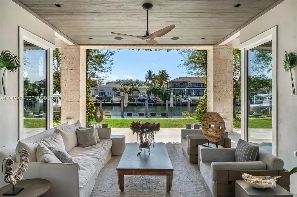 $38 Million Spectacular Waterfront Estate Redefines Coastal Mediterranean Luxury in Coral Gables 12 550 Marquesa Dr waterfront estate in Coral Gables featuring Coastal Mediterranean architecture, infinity pool, private canal dock, and luxury outdoor living spaces.