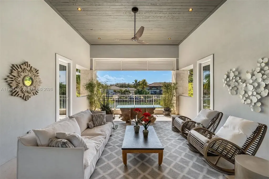 $38 Million Spectacular Waterfront Estate Redefines Coastal Mediterranean Luxury in Coral Gables 11 550 Marquesa Dr waterfront estate in Coral Gables featuring Coastal Mediterranean architecture, infinity pool, private canal dock, and luxury outdoor living spaces.