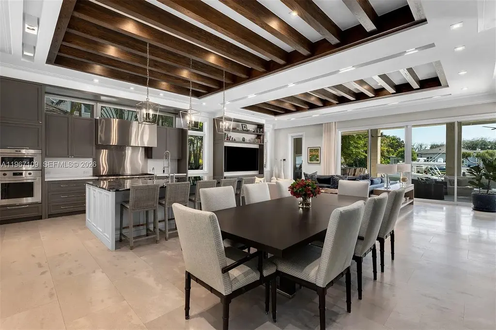 $38 Million Spectacular Waterfront Estate Redefines Coastal Mediterranean Luxury in Coral Gables 8 550 Marquesa Dr waterfront estate in Coral Gables featuring Coastal Mediterranean architecture, infinity pool, private canal dock, and luxury outdoor living spaces.