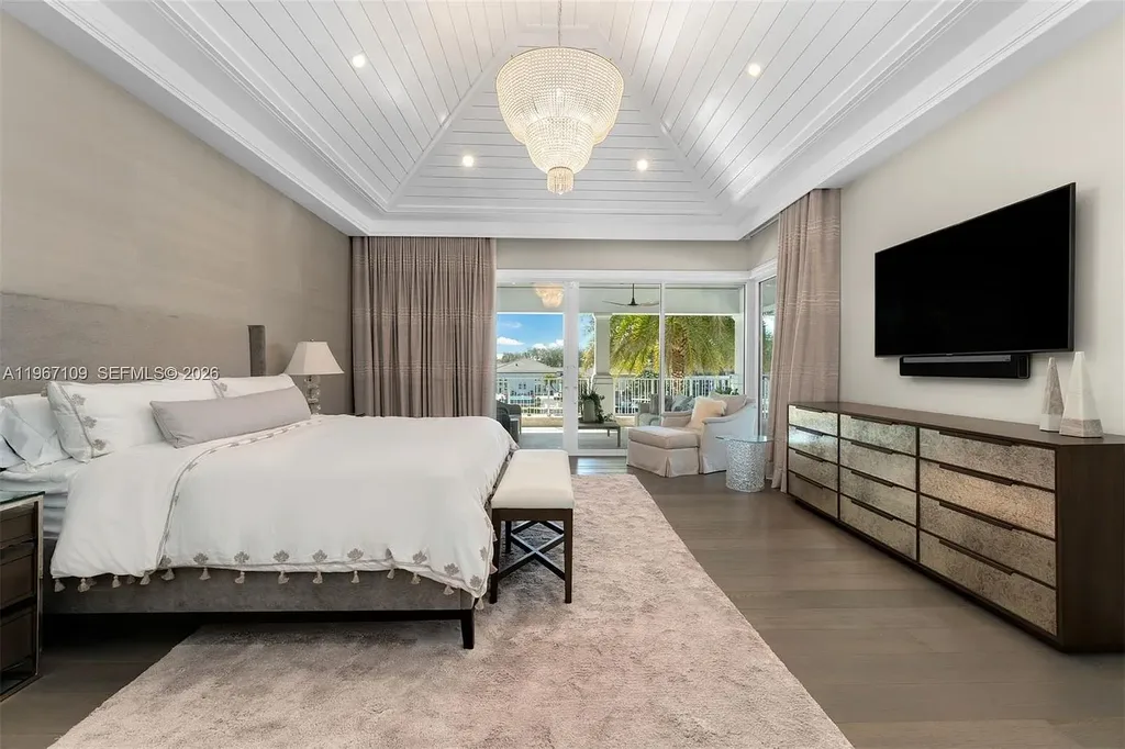 $38 Million Spectacular Waterfront Estate Redefines Coastal Mediterranean Luxury in Coral Gables 14 550 Marquesa Dr waterfront estate in Coral Gables featuring Coastal Mediterranean architecture, infinity pool, private canal dock, and luxury outdoor living spaces.