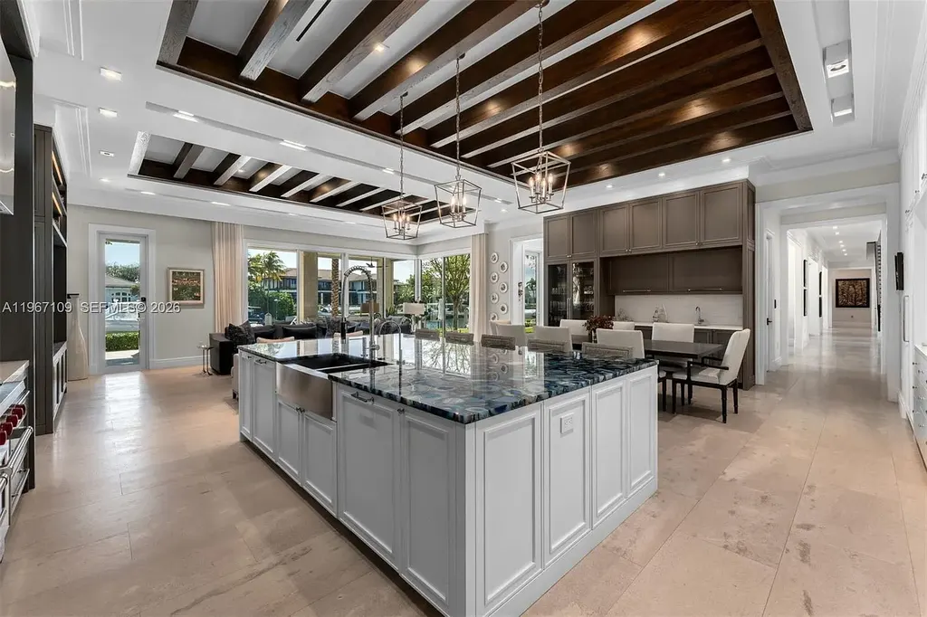 $38 Million Spectacular Waterfront Estate Redefines Coastal Mediterranean Luxury in Coral Gables 9 550 Marquesa Dr waterfront estate in Coral Gables featuring Coastal Mediterranean architecture, infinity pool, private canal dock, and luxury outdoor living spaces.