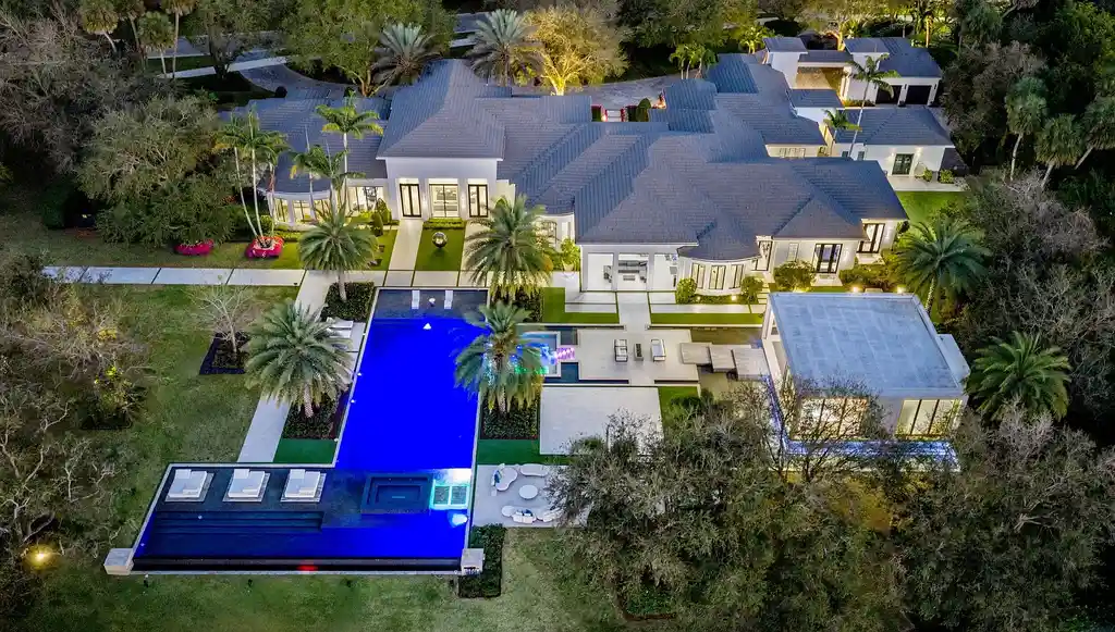 $55 Million Lakefront Estate in Delray Beach’s Stone Creek Ranch Showcases Resort-Style Luxury and Rare Double-Lot Privacy 17 Luxury lakefront estate exterior at 16191 Quiet Vista Circle in Delray Beach featuring expansive landscaping and contemporary architecture
