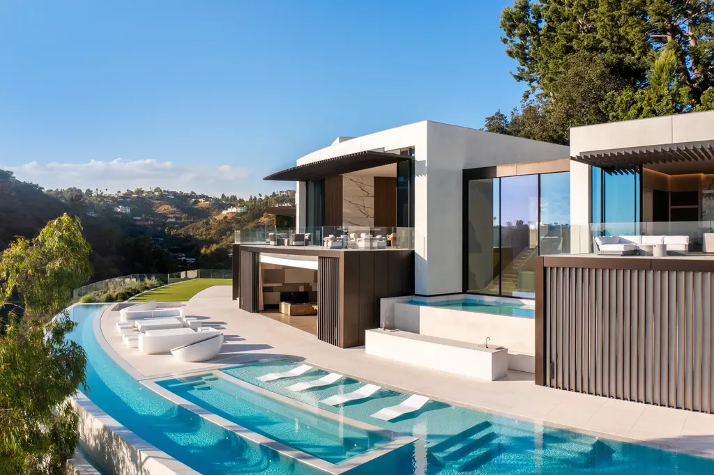 La Vue Mansion Commands $177 Million as a Singular Contemporary Icon in Bel Air 6 Infinity edge pool at La Vue Mansion in Bel Air featuring contemporary architecture layered terraces glass walls and panoramic hillside views over Los Angeles.