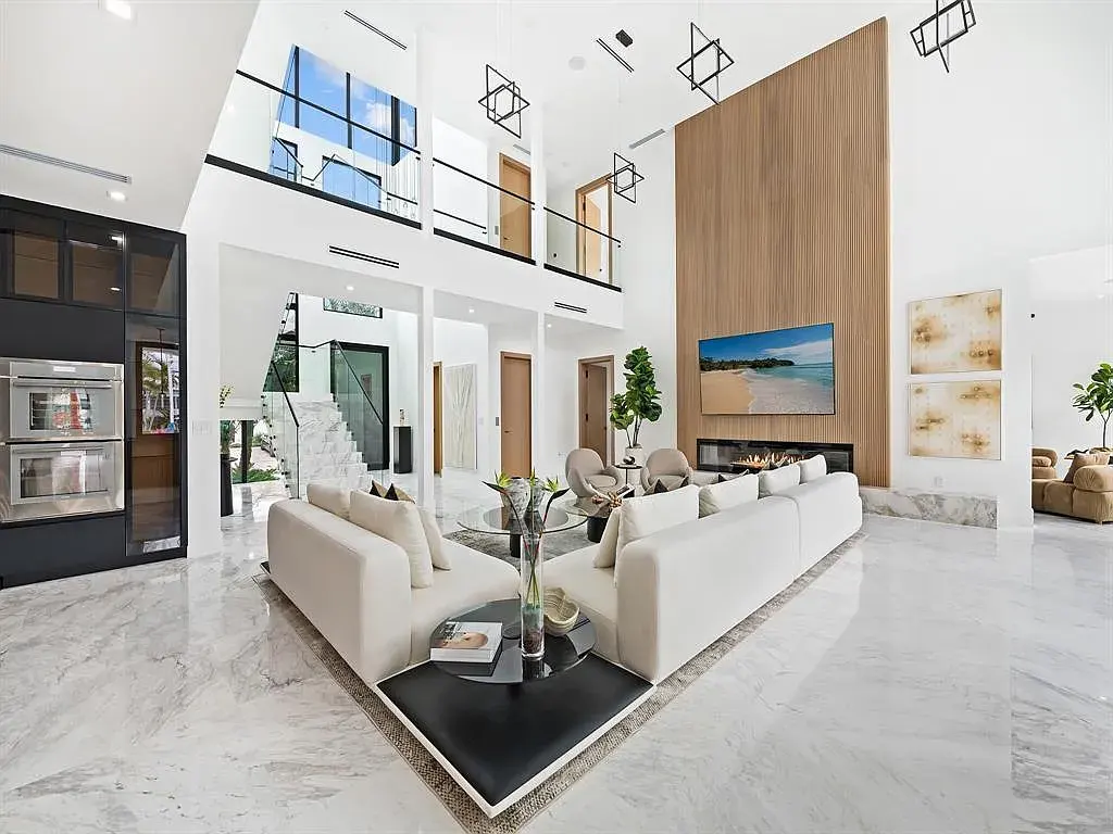 Stunning $10.2 Million New Construction Waterfront Mansion in Fort Lauderdale Hits the Market 7 Luxury waterfront home at 111 Fiesta Way in Fort Lauderdale with canal frontage, pool, and modern three-story architecture.